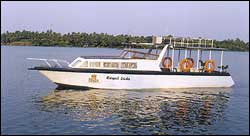 Royal  Cruise -  Cruise through the Kerala Backwaters and sail into Cochin Harbour  on Royal Lady, a luxury boat with double decks, A/C cabin and all modern facilities like wireless communication, freezer, microwave etc.